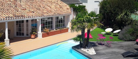 Seasonal outdoor pool, open 9 AM to 9 PM, pool loungers