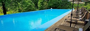 Seasonal outdoor pool, pool umbrellas, pool loungers