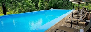 Seasonal outdoor pool, pool umbrellas, pool loungers