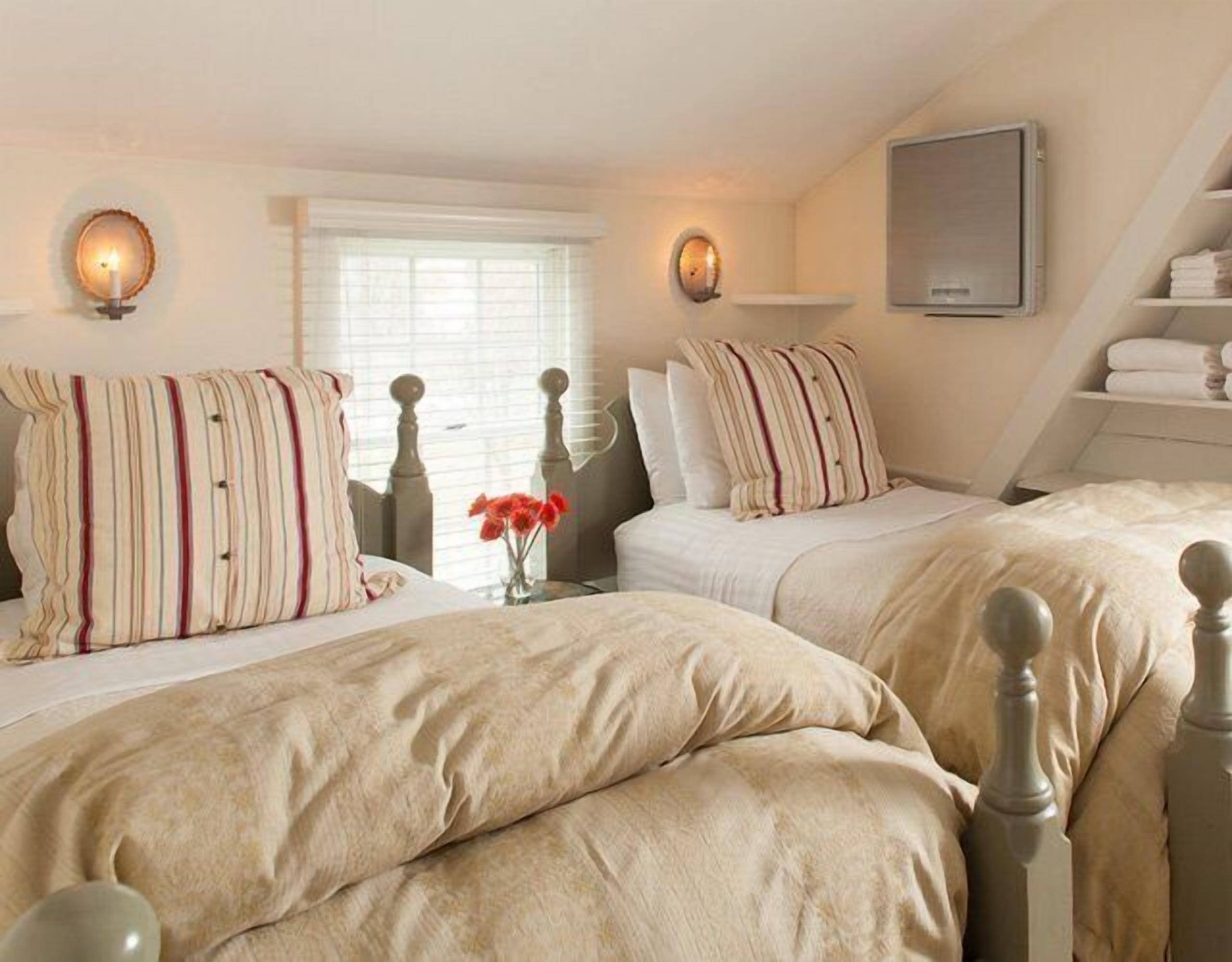 premium bedding, down duvets, pillow-top beds, individually decorated