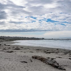 On the beach, surfing