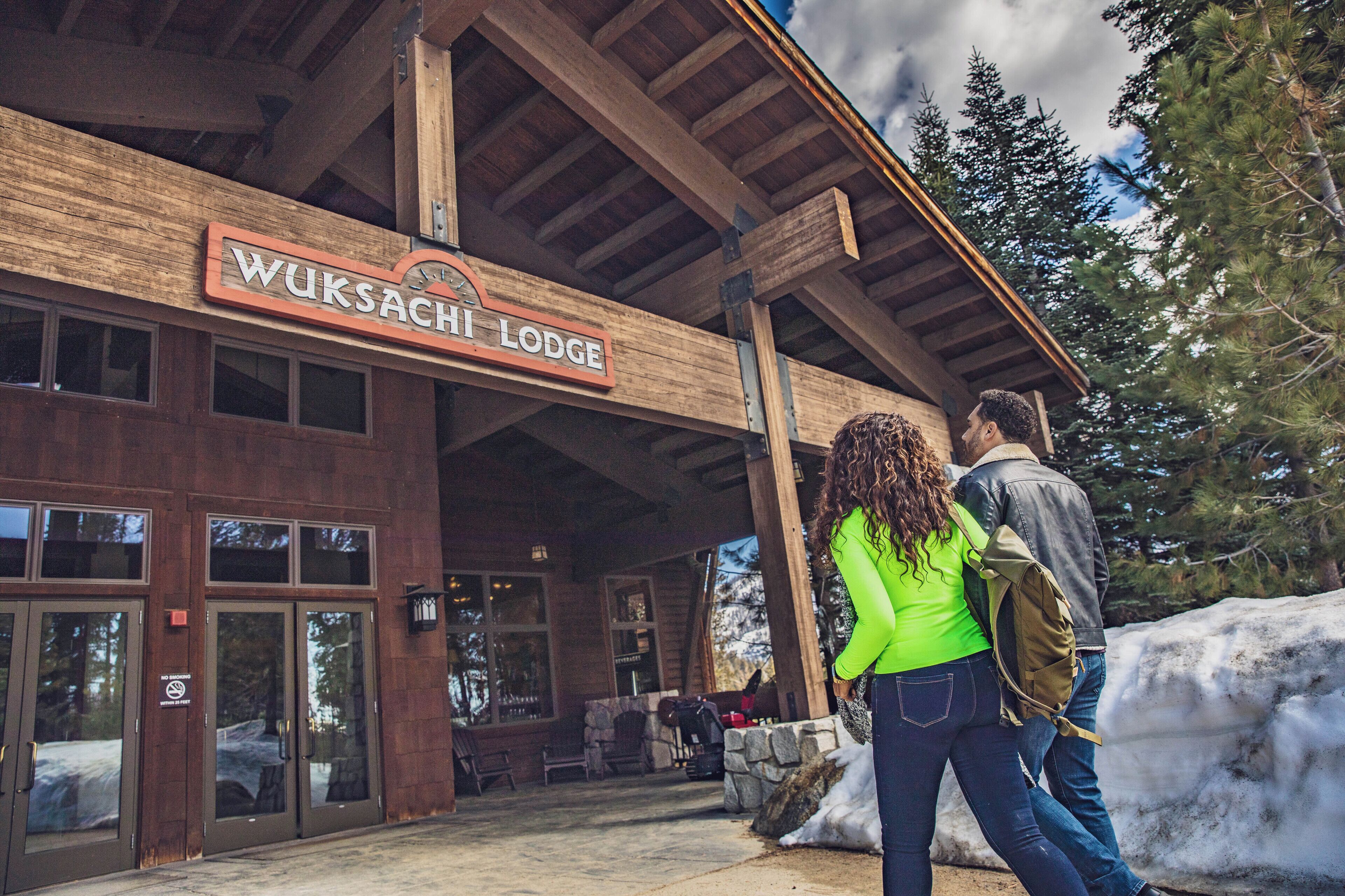 A wooden lodge with a sign reading "WUKSACHI LODGE".
