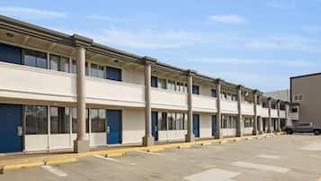 Rows of single-story buildings with uniform facades and aligned windows.