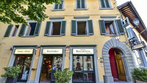 A building with three storefronts: VINO-OLIO, RISTORO, and HOTEL BELLAVISTA. - Hotel Bellavista Impruneta (Impruneta)