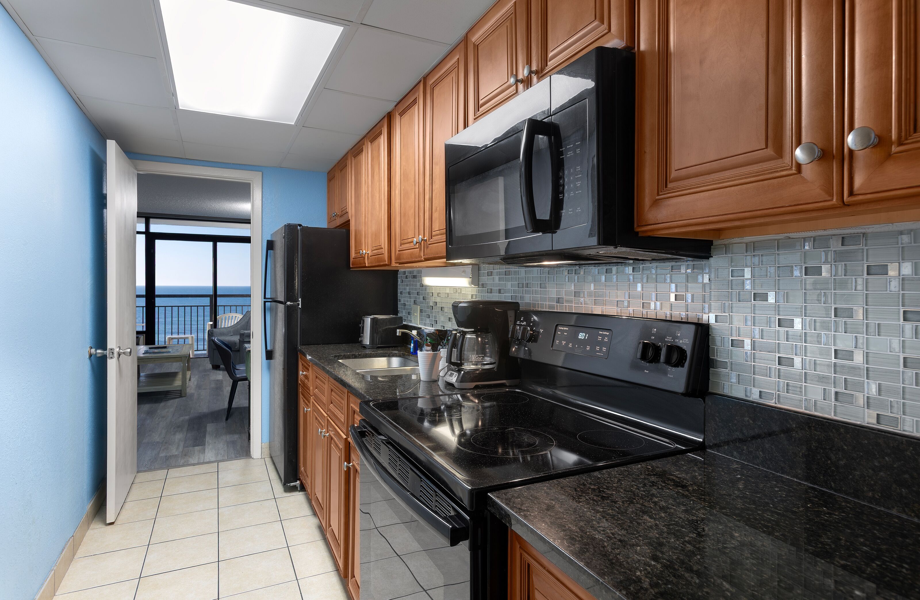 Fridge, microwave, coffee/tea maker, paper towels