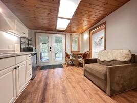 Nene #2 Studio: 1 King + Kitchenette + Pvt Entrance + Lanai | Living area | 36-inch flat-screen TV with cable channels, TV, Netflix