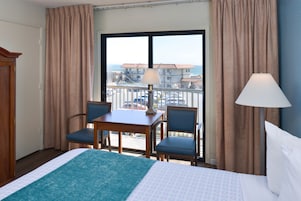 Two Queens Balcony With Partial Views | Desk, iron/ironing board, cribs/infant beds, rollaway beds