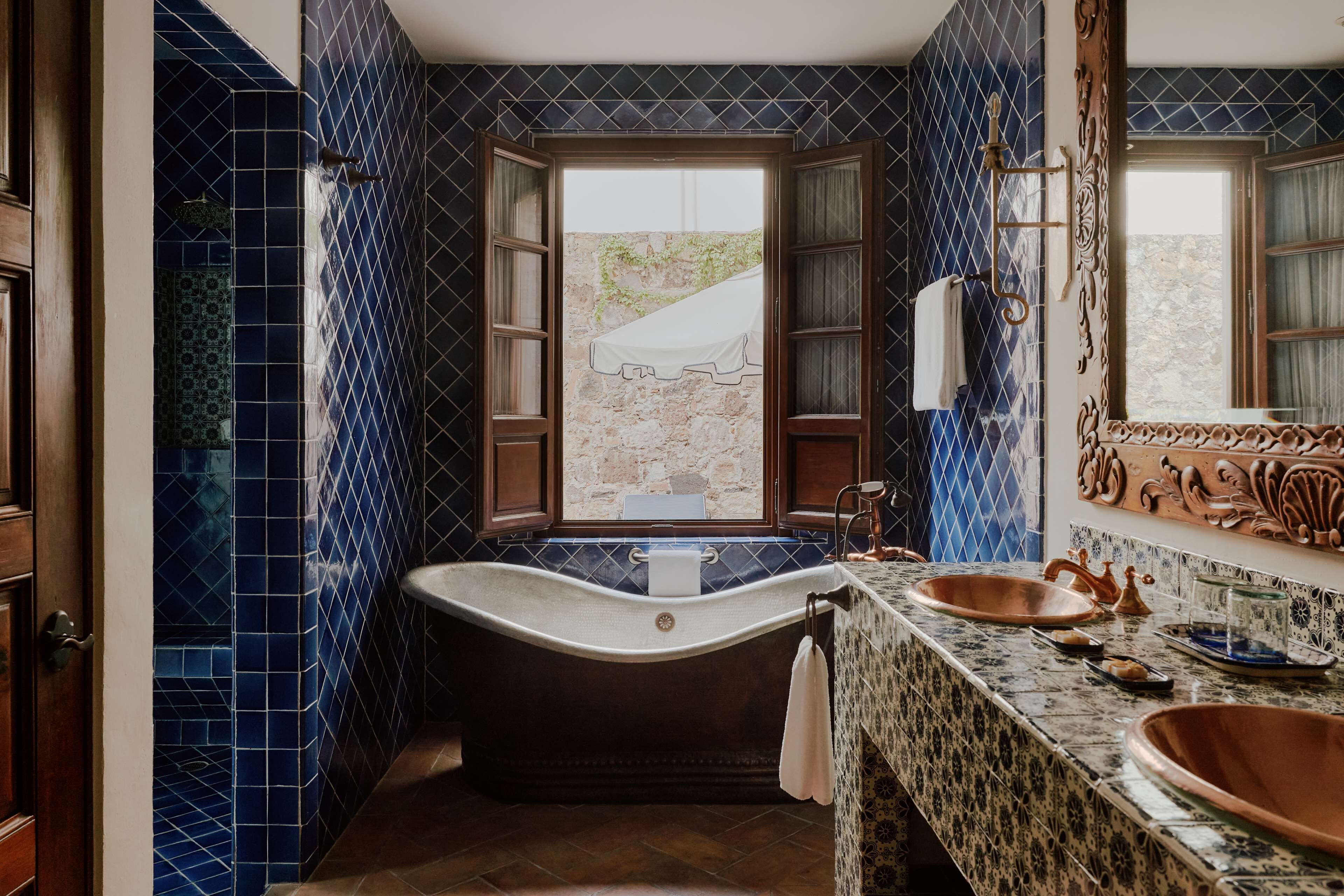 deluxe suite, 1 bedroom | bathroom | designer toiletries, hair dryer, bathrobes, slippers