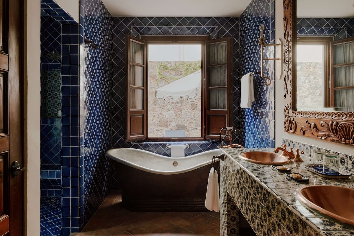 deluxe suite, 1 bedroom | bathroom | designer toiletries, hair dryer, bathrobes, slippers