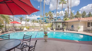 Relax by the pool surrounded by palm trees and a tropical atmosphere.