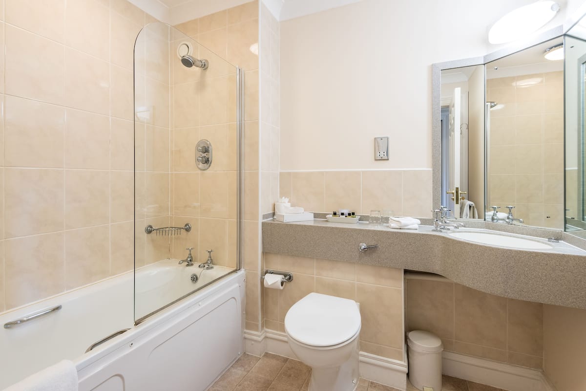 standard twin room (riverside building) | bathroom | combined shower/bathtub, hair dryer, towels