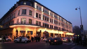 A historic building with a classic European architectural style, featuring a prominent curved facade and a central entrance. - Hotel Mayet (Paris)