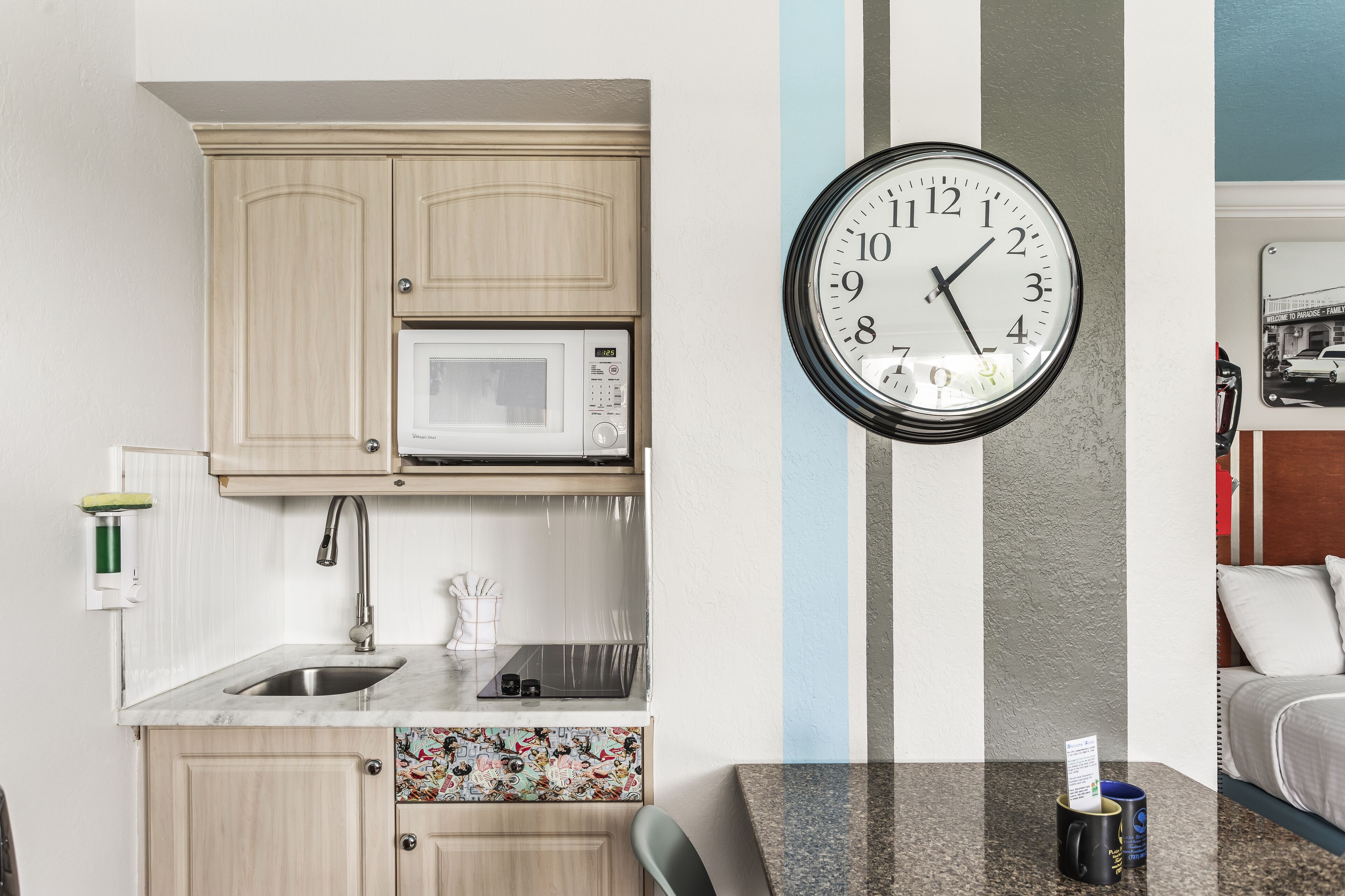 full-sized fridge, microwave, stovetop, coffee/tea maker