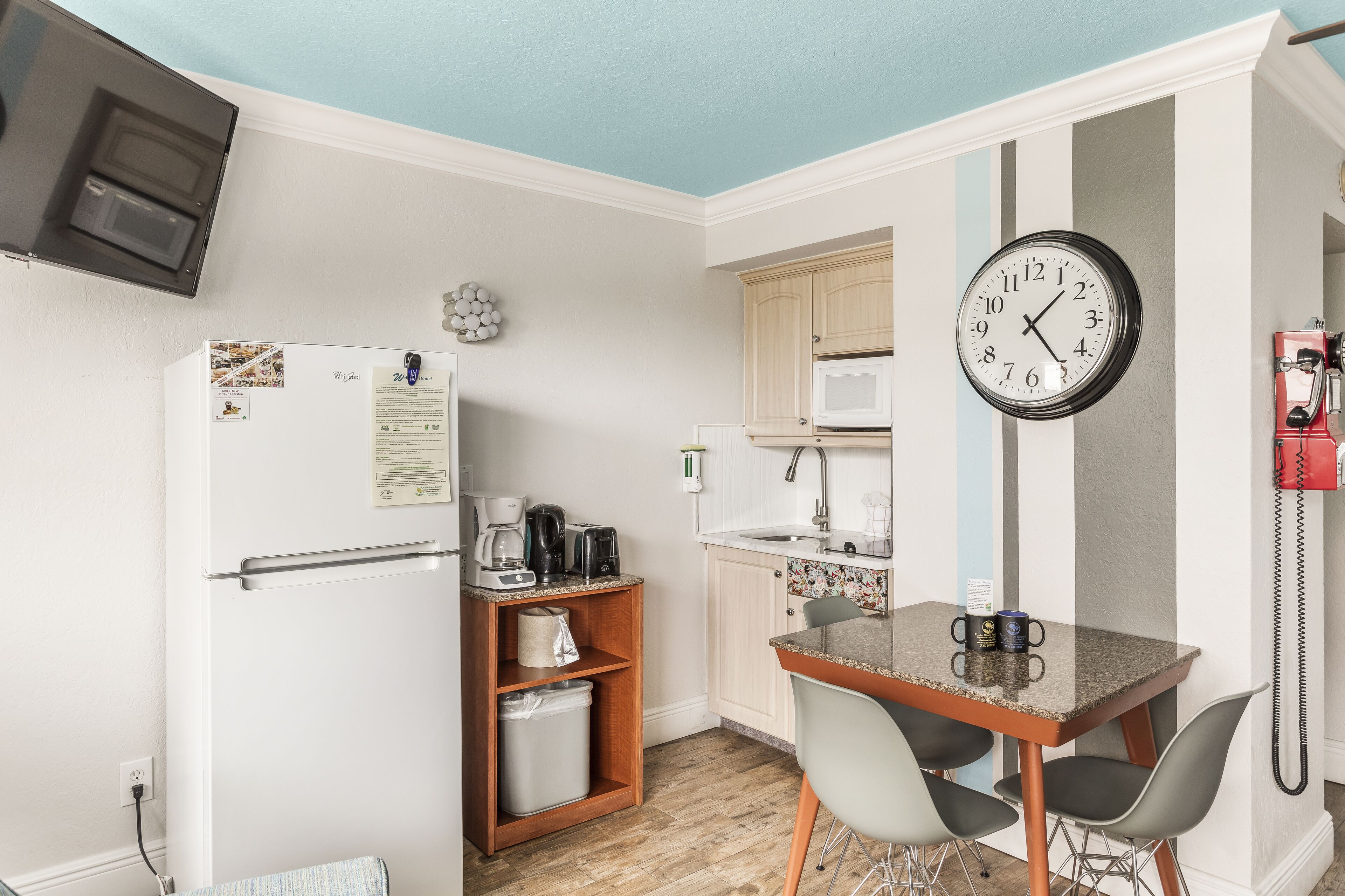 full-sized fridge, microwave, stovetop, coffee/tea maker