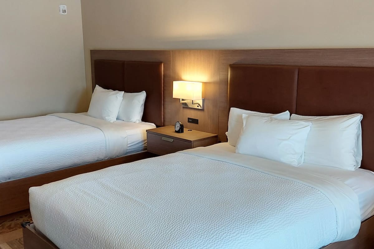 deluxe room, 2 queen beds, accessible, ocean view balcony | 1 bedroom, desk, laptop workspace, blackout curtains