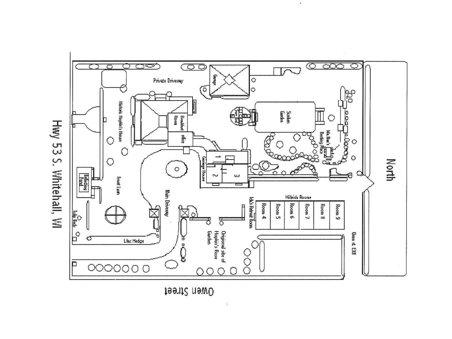 A floor plan of a hotel with a private driveway, a garage, and a garden.