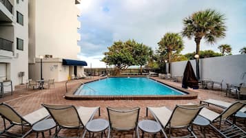 Outdoor pool, a heated pool, open 8:00 AM to 8:00 PM, pool umbrellas