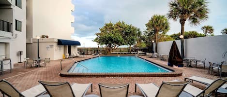 Outdoor pool, a heated pool, open 8:00 AM to 8:00 PM, pool umbrellas