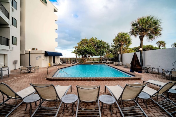 Outdoor pool, a heated pool, open 8:00 AM to 8:00 PM, pool umbrellas