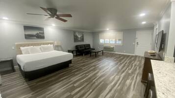 Family Suite, 2 Bedrooms, Kitchen | Living area | 32-inch flat-screen TV with cable channels, TV