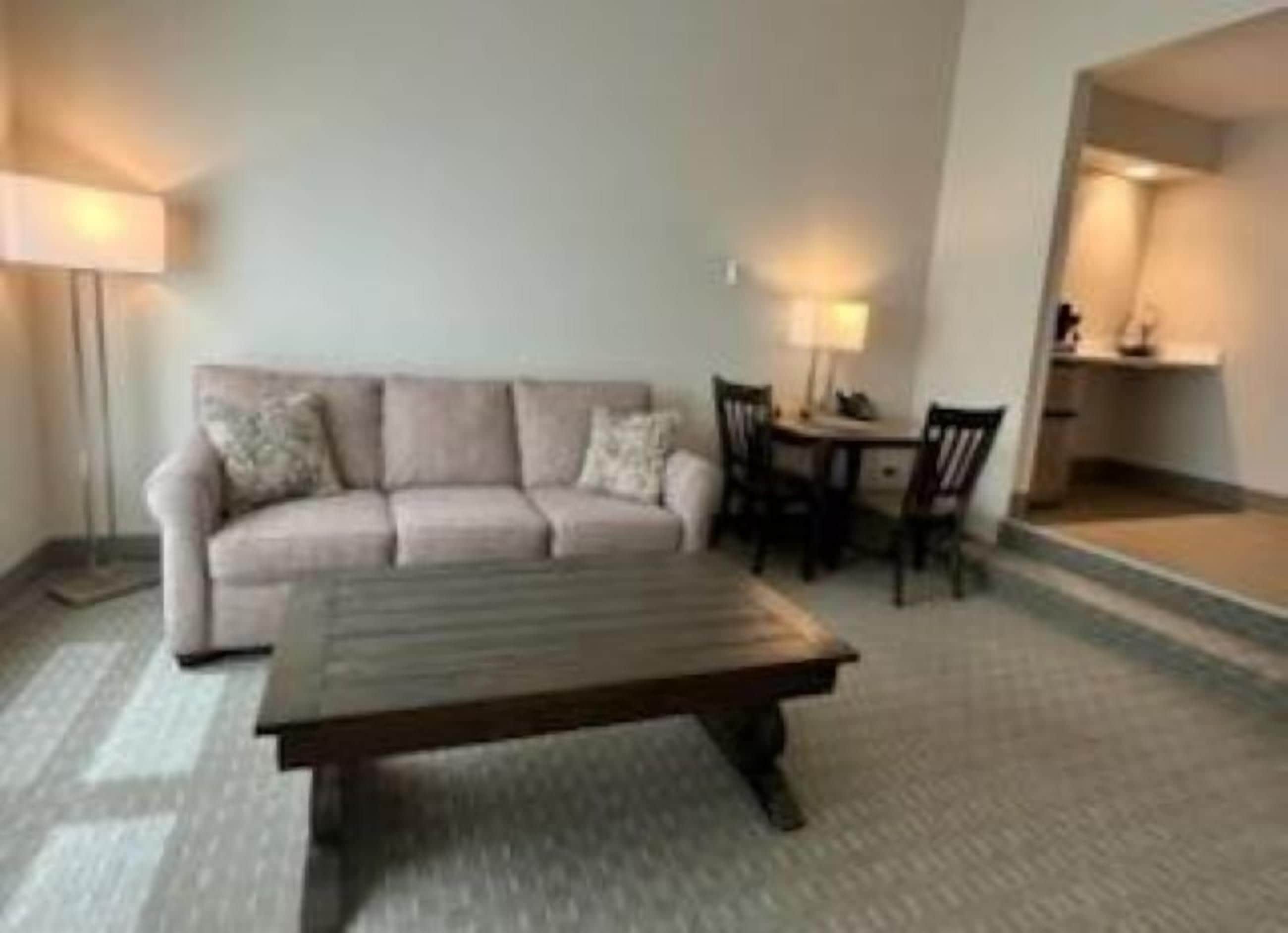 Standard Room | Living area | 55-inch TV with cable channels
