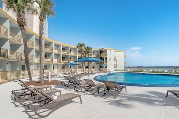 Outdoor pool, sun loungers at Chateau Beachfront Hotel, A By The Sea Resort