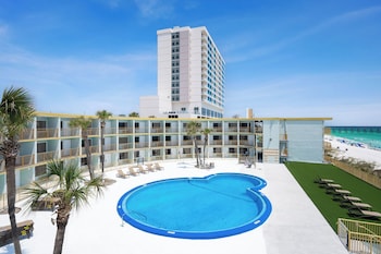 Outdoor pool, sun loungers at Chateau Beachfront Hotel, A By The Sea Resort