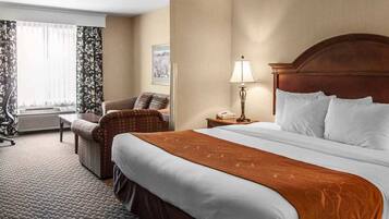 Desk, laptop workspace, blackout drapes, iron/ironing board