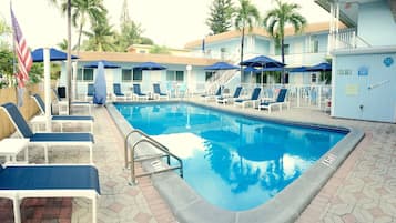 Outdoor pool, pool umbrellas, sun loungers
