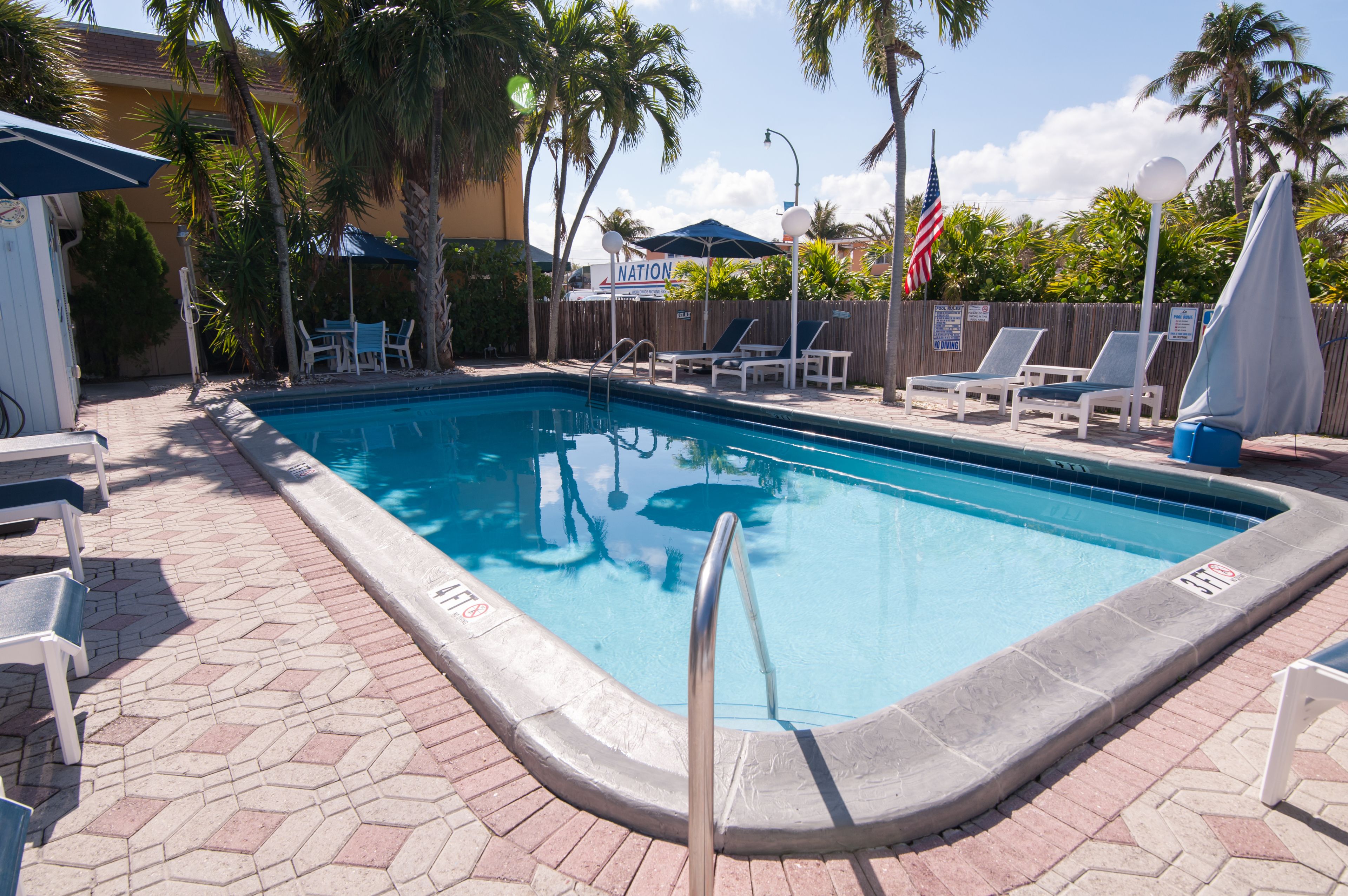 outdoor pool, pool umbrellas, pool loungers