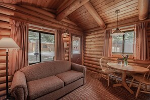 Deluxe Cabin, 2 Queen Beds w/Sofabed | Living room | Flat-screen TV
