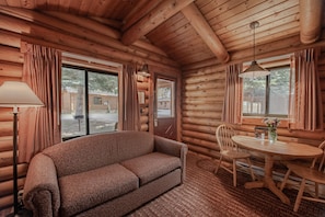 Deluxe Cabin, 2 Queen Beds w/Sofabed | Living room | Flat-screen TV