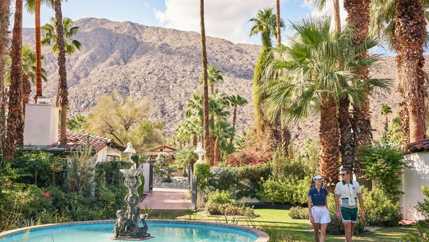 A pool with a statue, surrounded by palm trees and a mountain in the background. - Ingleside Estate Hotel & Bungalows- Adults Only (Palm Springs)