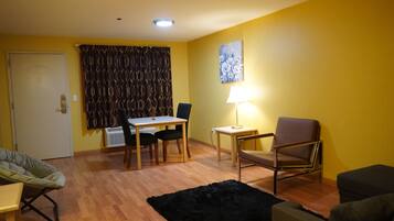 Family Suite, Non Smoking | Living area | 32-inch LED TV with cable channels, TV