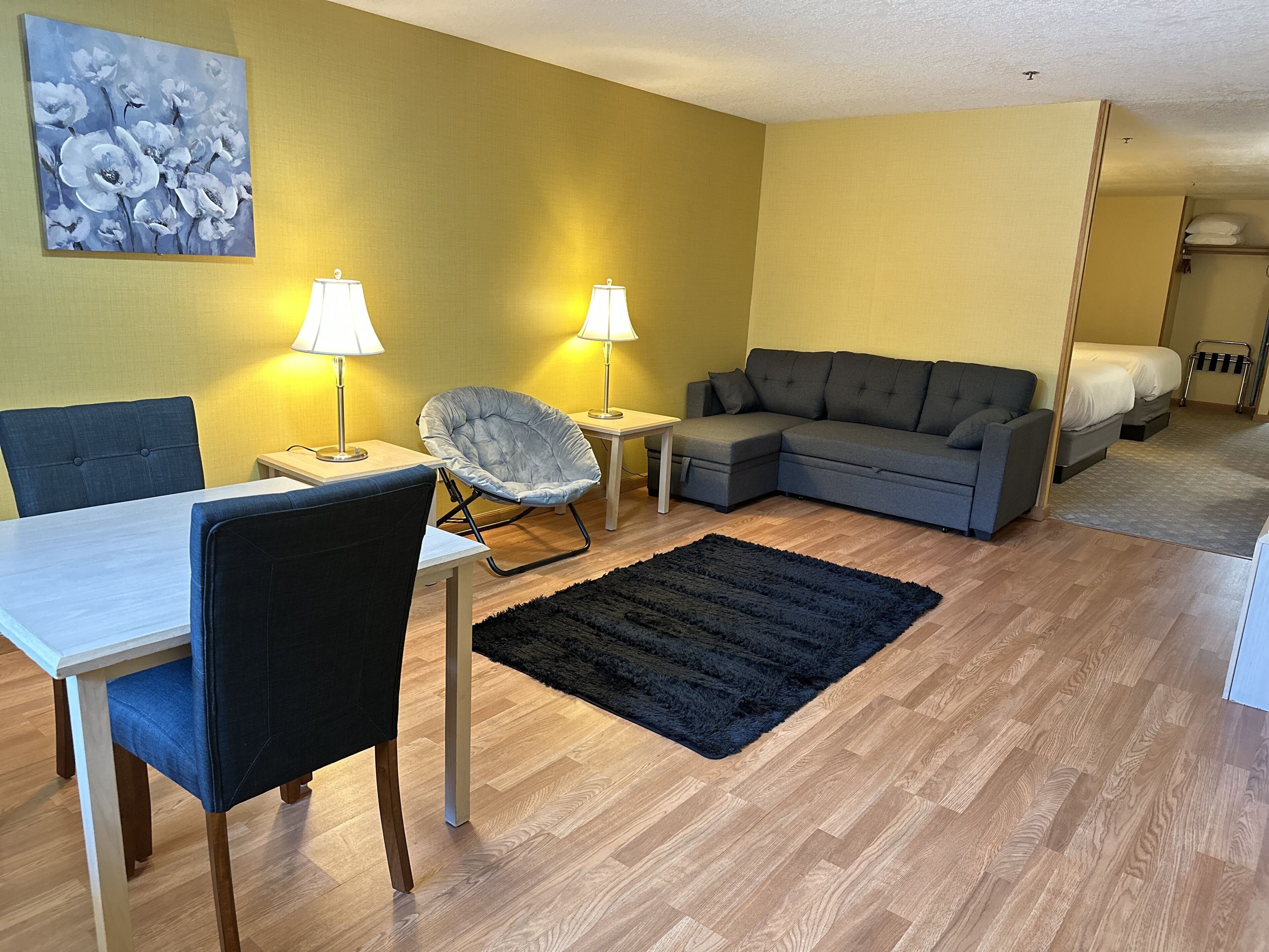 Family Suite, Non Smoking | Living area | 32-inch LED TV with cable channels, TV