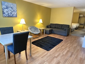 Family Suite, Non Smoking | Living area | 32-inch LED TV with cable channels, TV