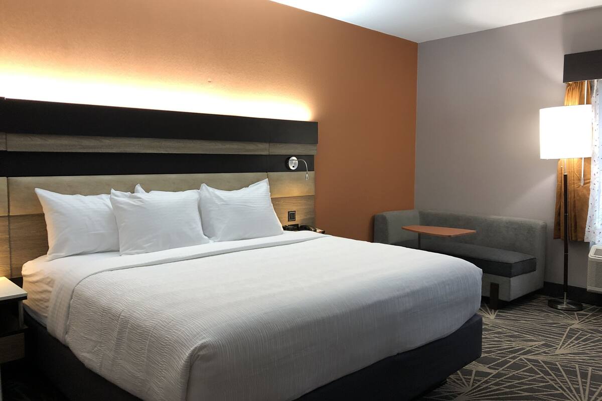 pillow-top beds, laptop workspace, blackout curtains, iron/ironing board