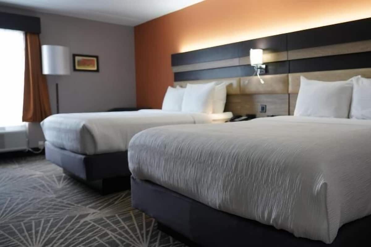 Pillowtop beds, laptop workspace, blackout drapes, iron/ironing board