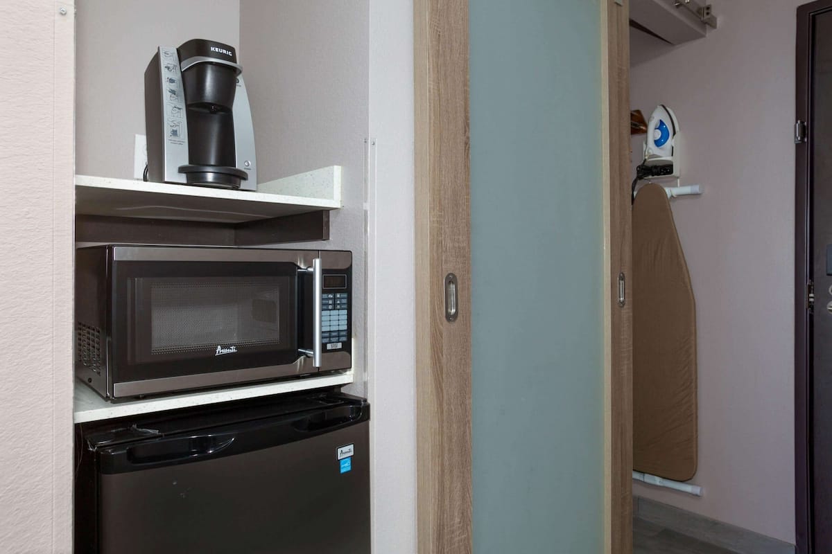 pillow-top beds, laptop workspace, blackout curtains, iron/ironing board