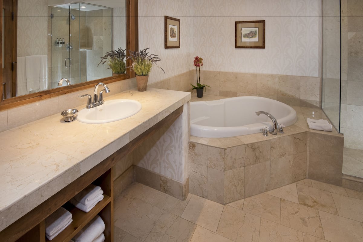 designer toiletries, hair dryer, bathrobes, slippers