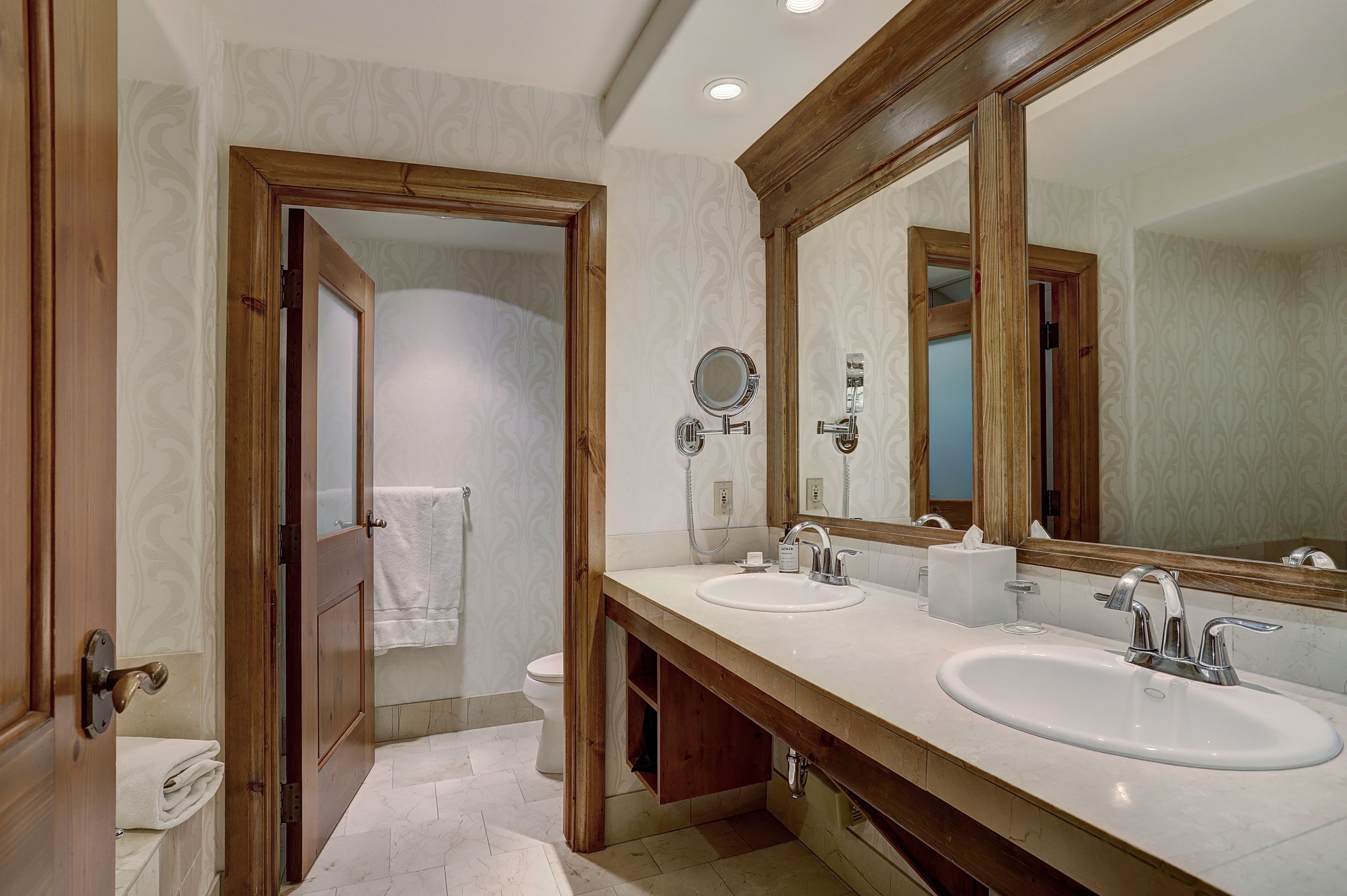 designer toiletries, hair dryer, bathrobes, slippers