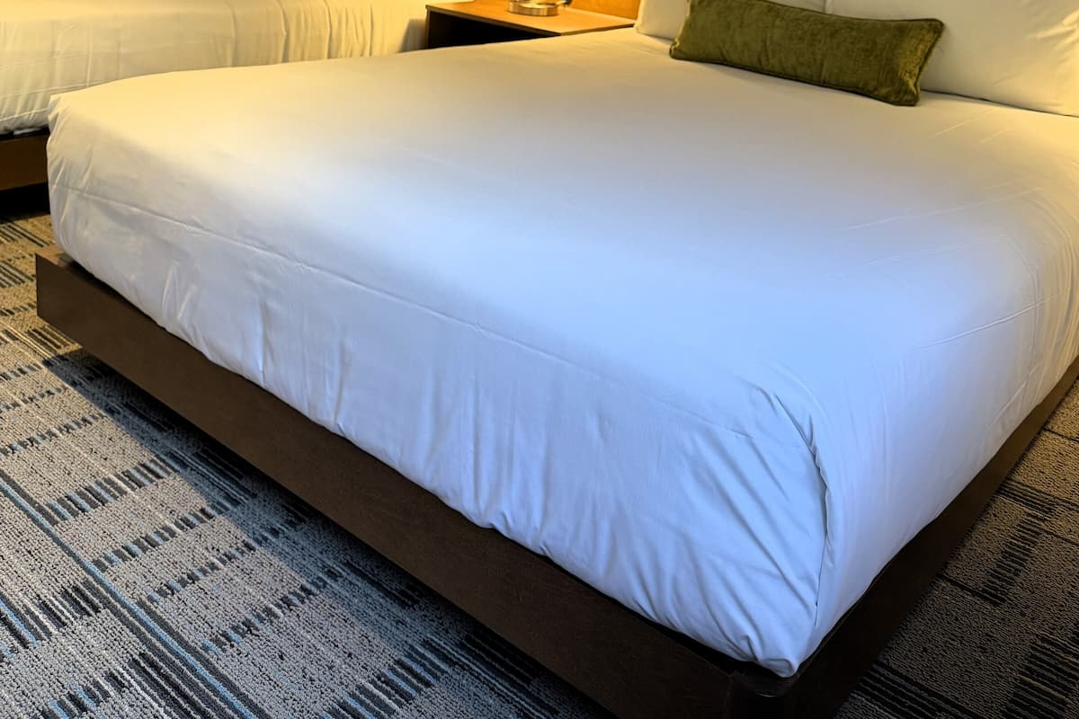 Premium bedding, desk, laptop workspace, iron/ironing board