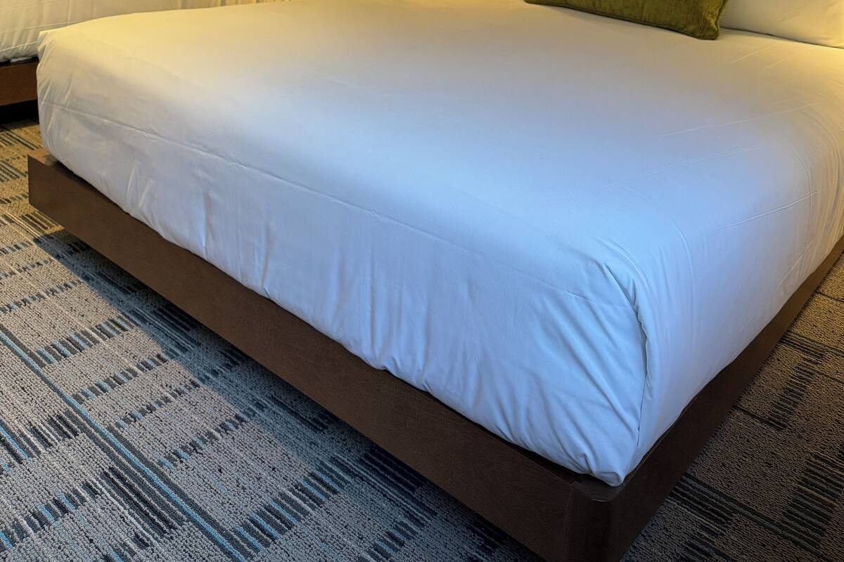 Premium bedding, desk, laptop workspace, iron/ironing board