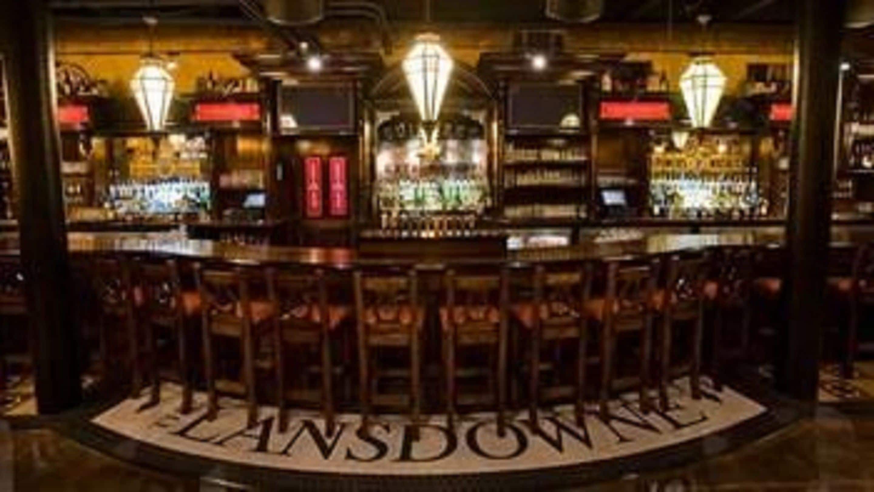 A bar area with a circular seating arrangement and a sign that reads "LANSDOWN."