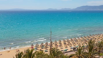 On the beach, white sand, beach towels
