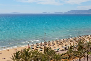 On the beach, white sand, beach towels