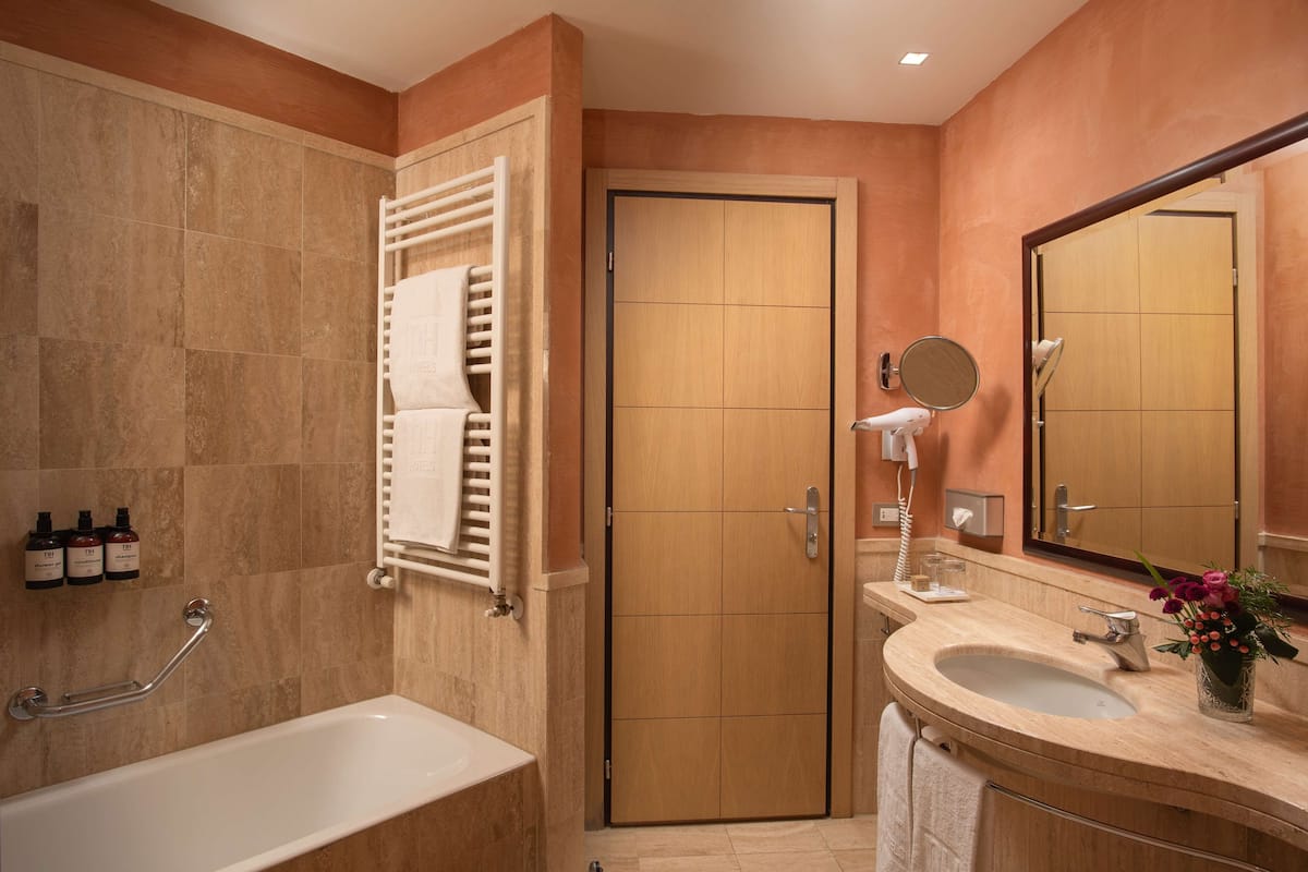 eco-friendly toiletries, hair dryer, bidet, towels