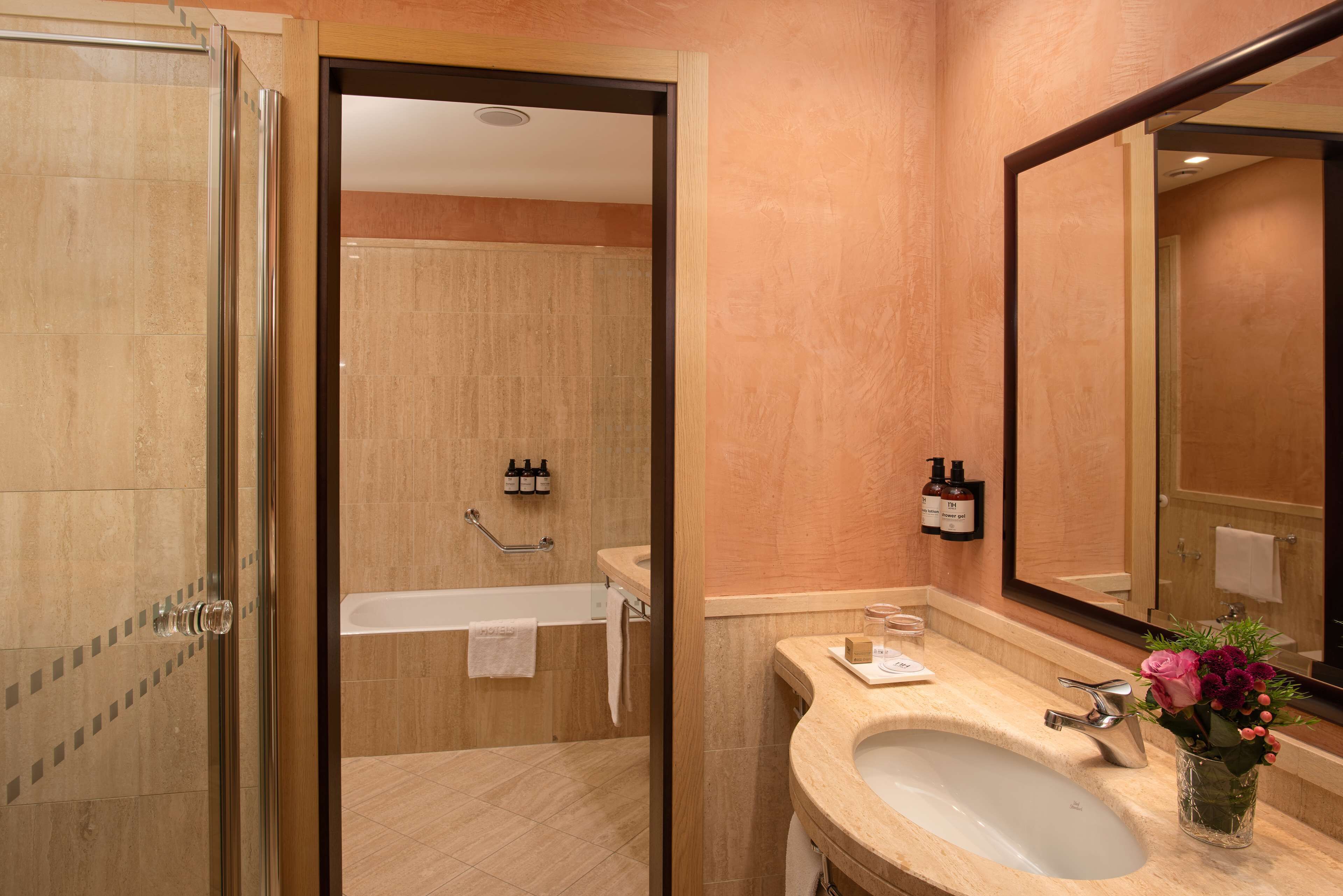 premium room | bathroom | eco-friendly toiletries, hair dryer, bidet, towels