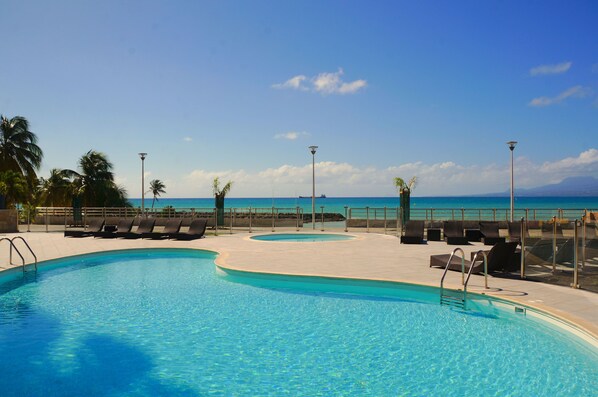 Outdoor pool, pool umbrellas, sun loungers