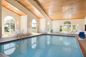 Indoor pool, open 6:00 AM to midnight, pool loungers